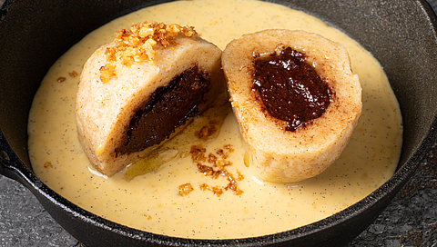 Curd cheese dumplings with chocolate centre and hazelnut crumbs